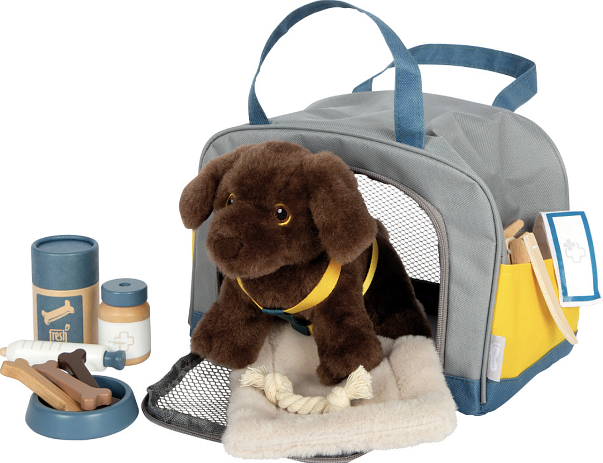 Chien avec sac et kit de soins